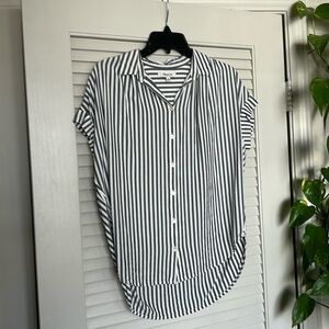 Collared button up striped shirt.